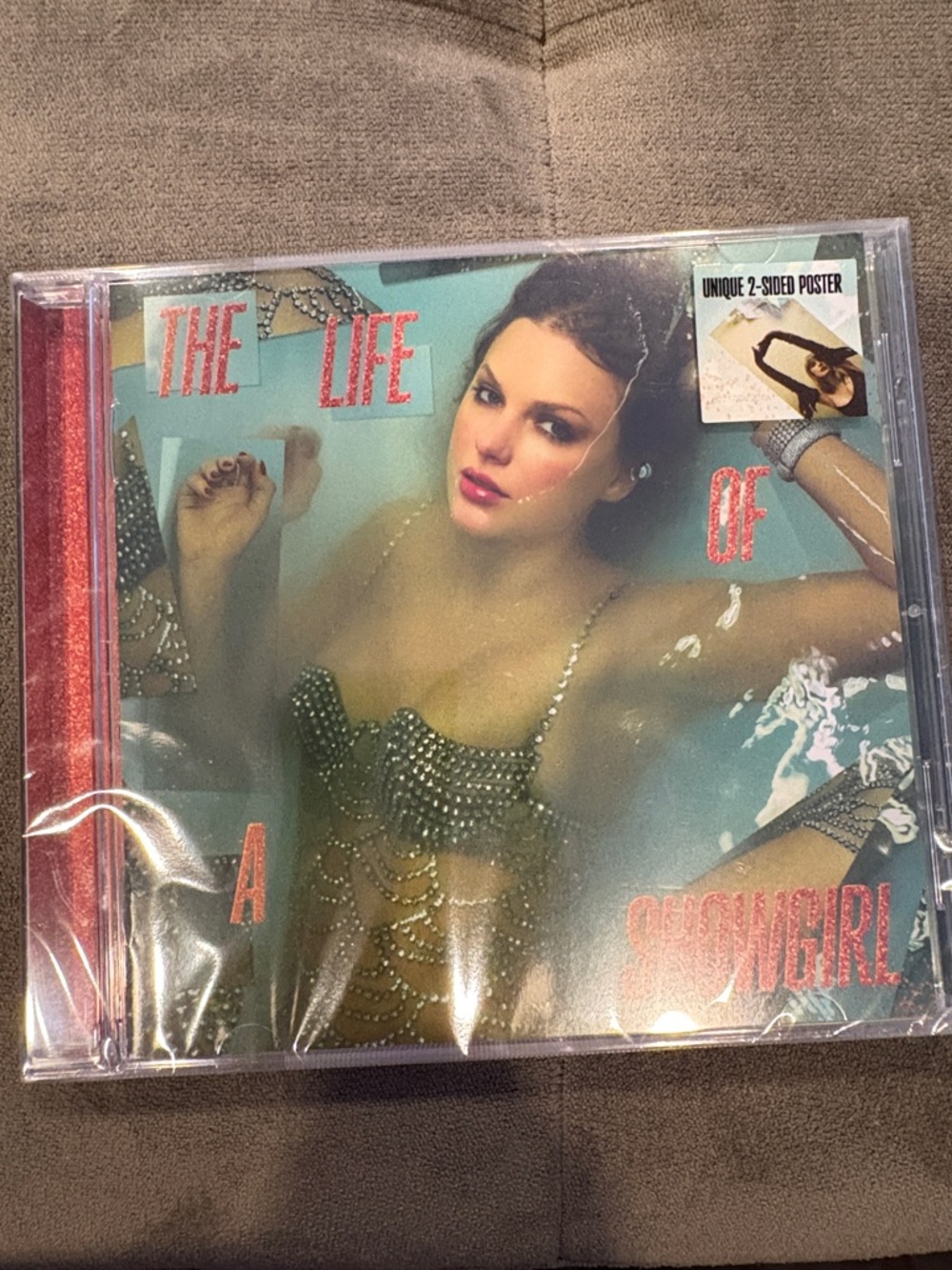 Taylor Swift CD of latest album, The Life of a Showgirl, includes 2-sided poster